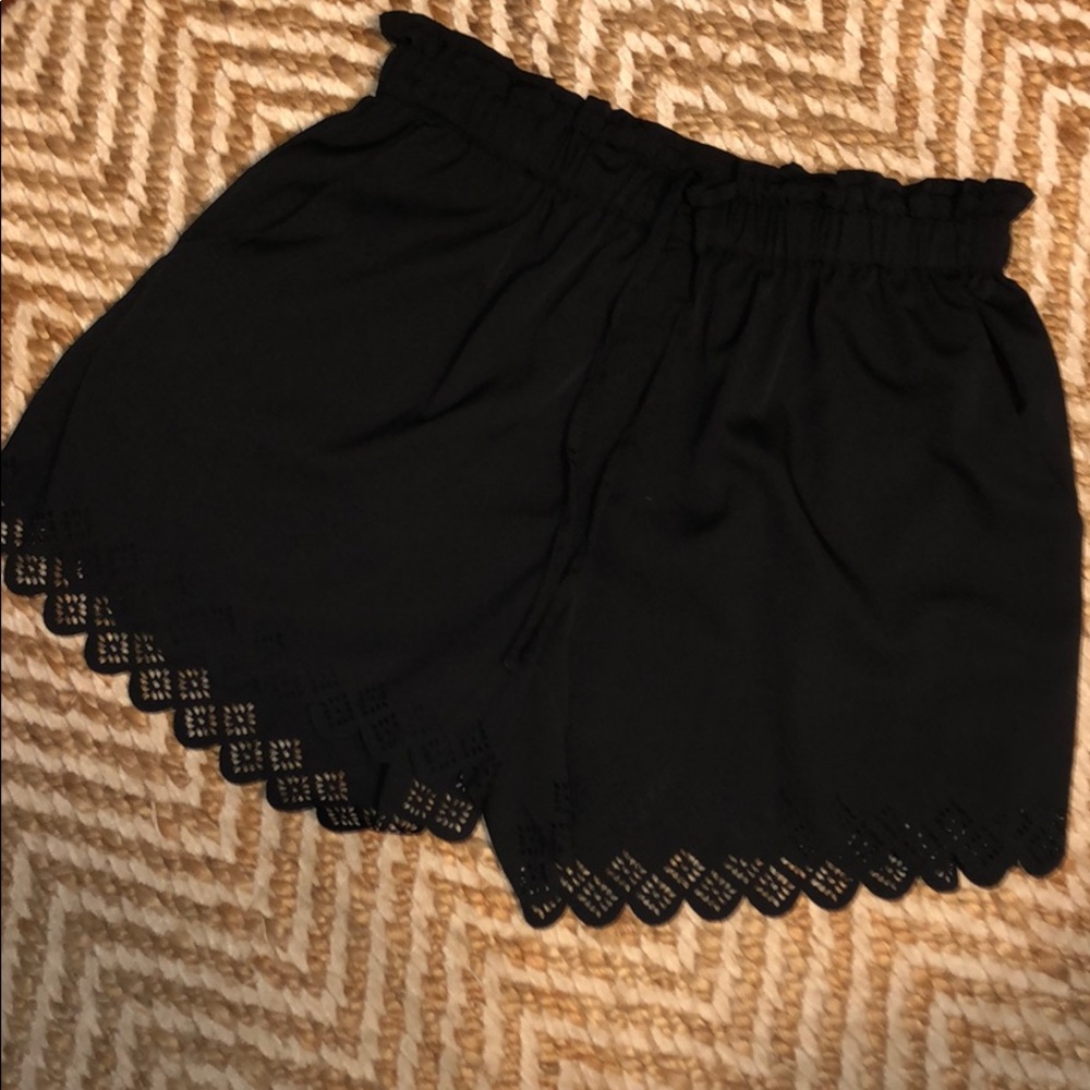 Black dress shorts with a scalloped edge